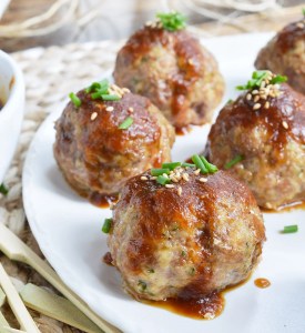 These Saucy Asian Meatballs are perfect for parties! This easy appetizer recipe is a combo of baked meatballs and a sweet ginger sauce that takes just 10 minutes to make.