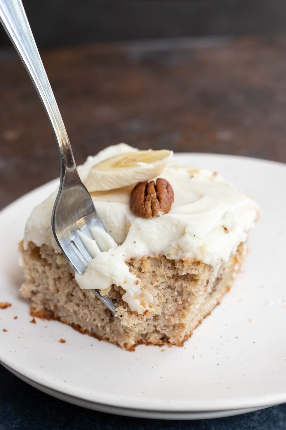 fork taking a bite out of banana cake